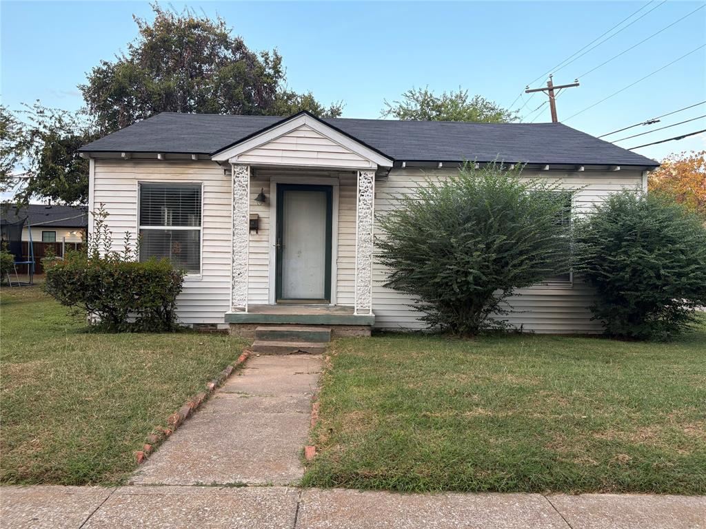 3424 Kimble Street Dallas, TX 75215 - Photo 2 of 5 a front view of a house with garden