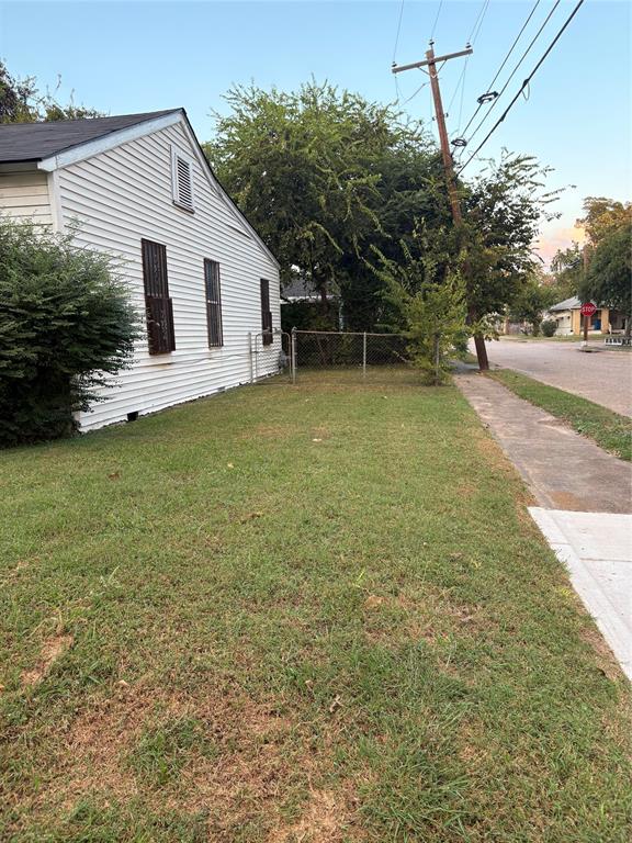 3424 Kimble Street Dallas, TX 75215 - Photo 4 of 5 a view of a house with a backyard