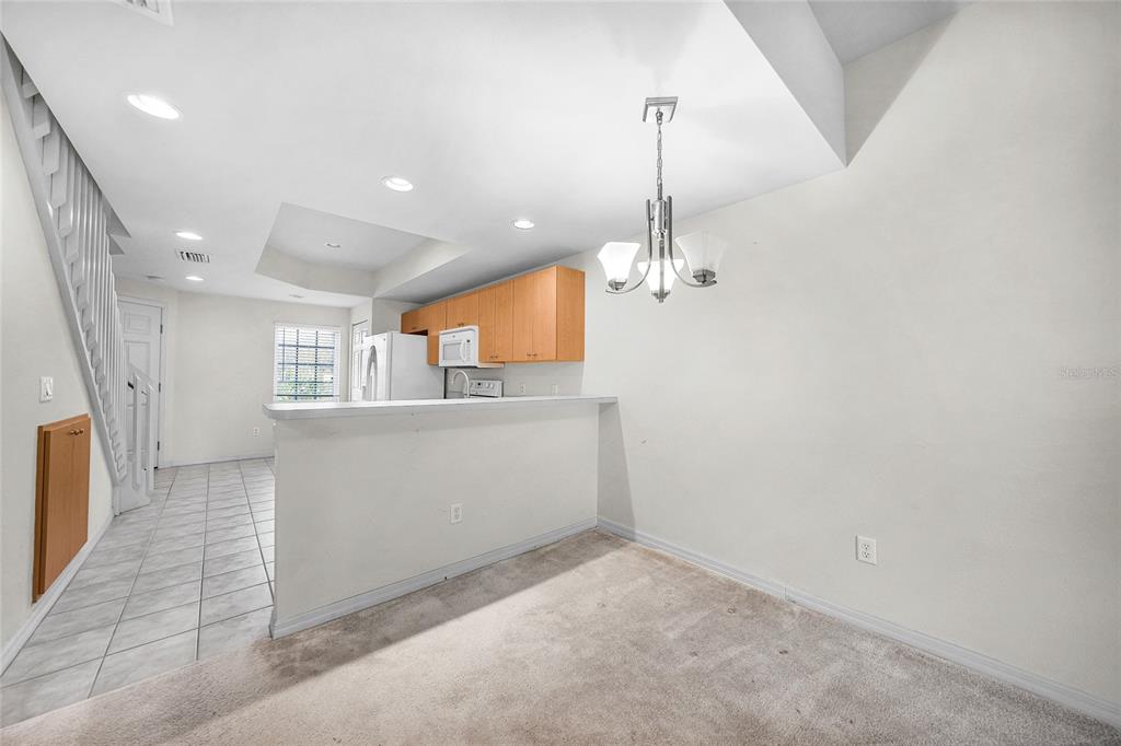 1246 Rio De Janeiro Avenue, Unit 505 Punta Gorda, FL 33983 - Photo 12 of 49 a view of a kitchen with a sink and dishwasher wooden floor
