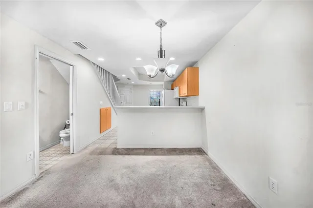 a view of an empty room with windows