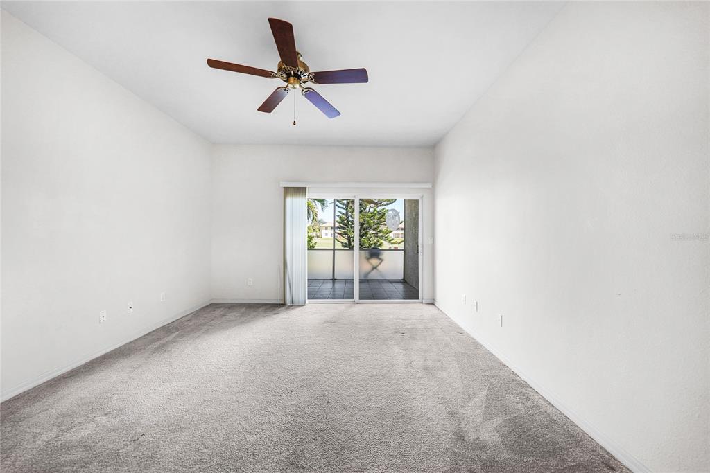 1246 Rio De Janeiro Avenue, Unit 505 Punta Gorda, FL 33983 - Photo 15 of 49 a view of a livingroom with a ceiling fan and window