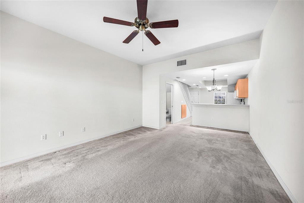 1246 Rio De Janeiro Avenue, Unit 505 Punta Gorda, FL 33983 - Photo 16 of 49 an empty room with a ceiling fan and window