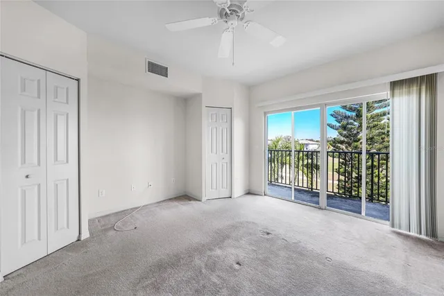 a view of a city with lawn chairs under an umbrella