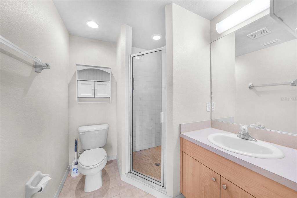 1246 Rio De Janeiro Avenue, Unit 505 Punta Gorda, FL 33983 - Photo 23 of 49 a white toilet sitting next to a bathroom sink