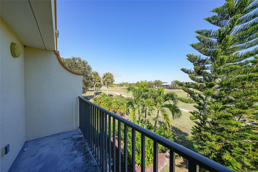 1246 Rio De Janeiro Avenue, Unit 505 Punta Gorda, FL 33983 - Photo 25 of 49 a view of balcony with wooden floor