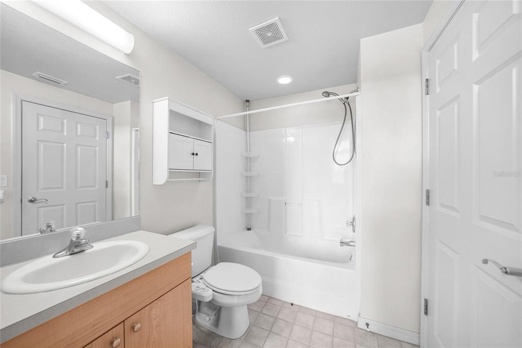 1246 Rio De Janeiro Avenue, Unit 505 Punta Gorda, FL 33983 - Photo 30 of 49 a bathroom with a sink a toilet and shower