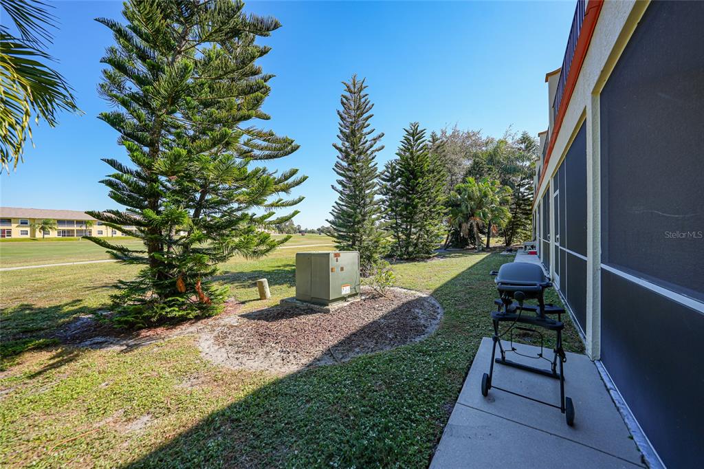 1246 Rio De Janeiro Avenue, Unit 505 Punta Gorda, FL 33983 - Photo 36 of 49 a view of a backyard with sitting area