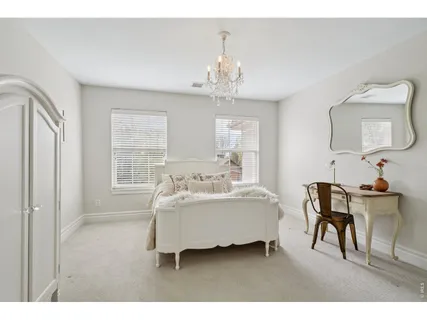 a dining room with a table and chairs