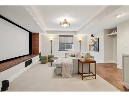 a living room with furniture a window and a table
