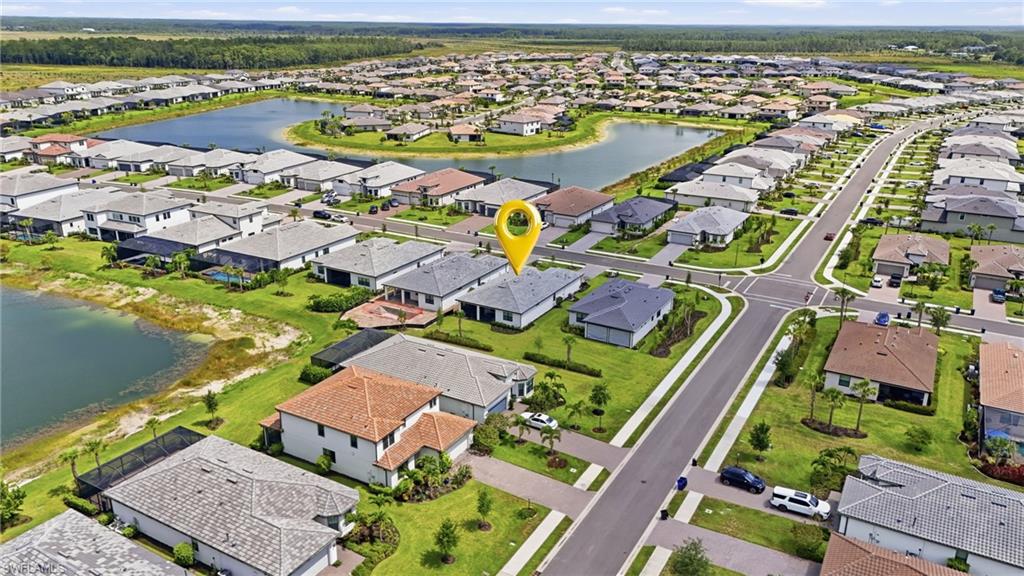 18364 Ridgeline Drive Estero, FL 33928 - Photo 39 of 50 an aerial view of residential houses with outdoor space
