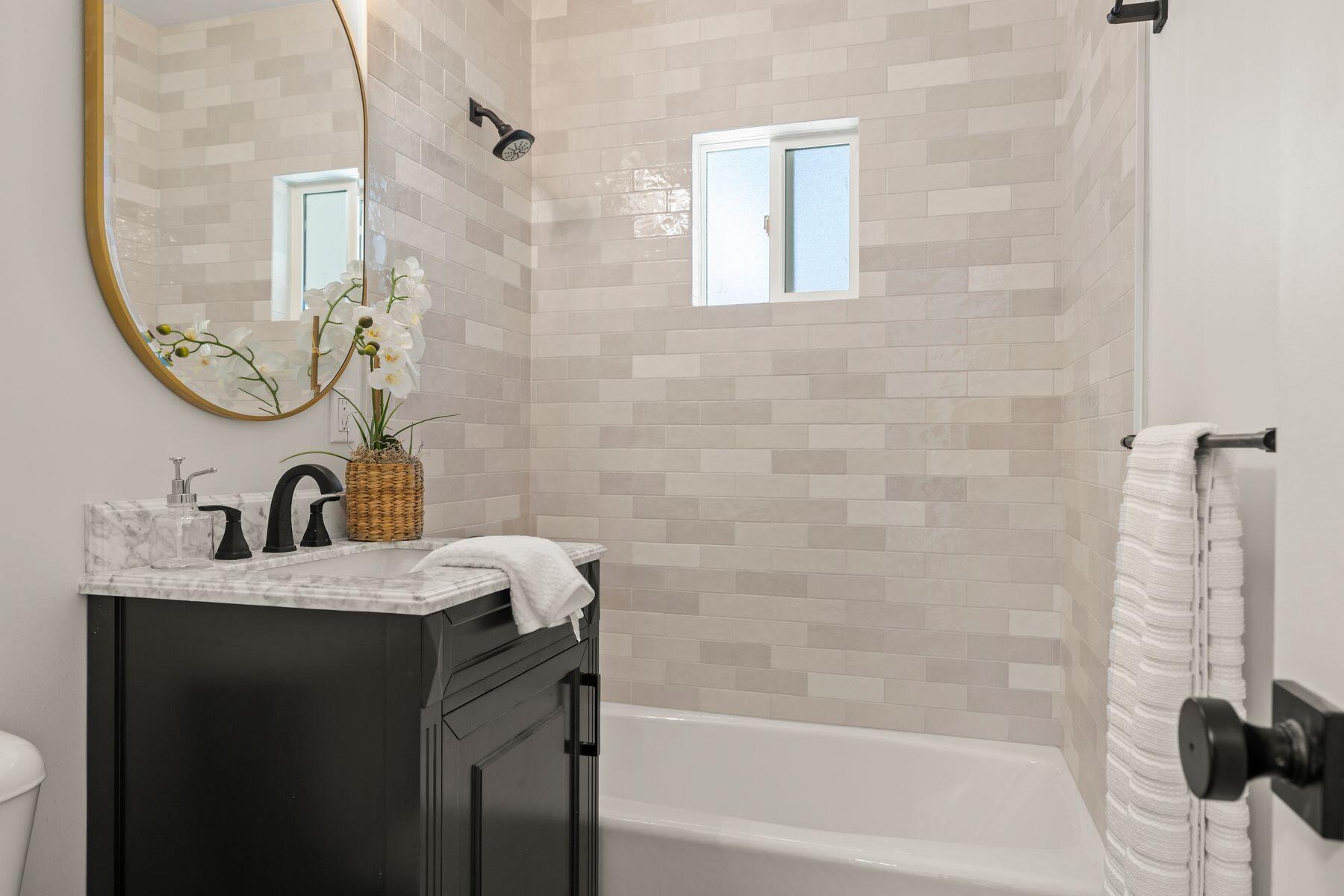 375 North Poli Avenue Ojai, CA 93023 - Photo 12 of 24 a bathroom with a sink a toilet and a mirror