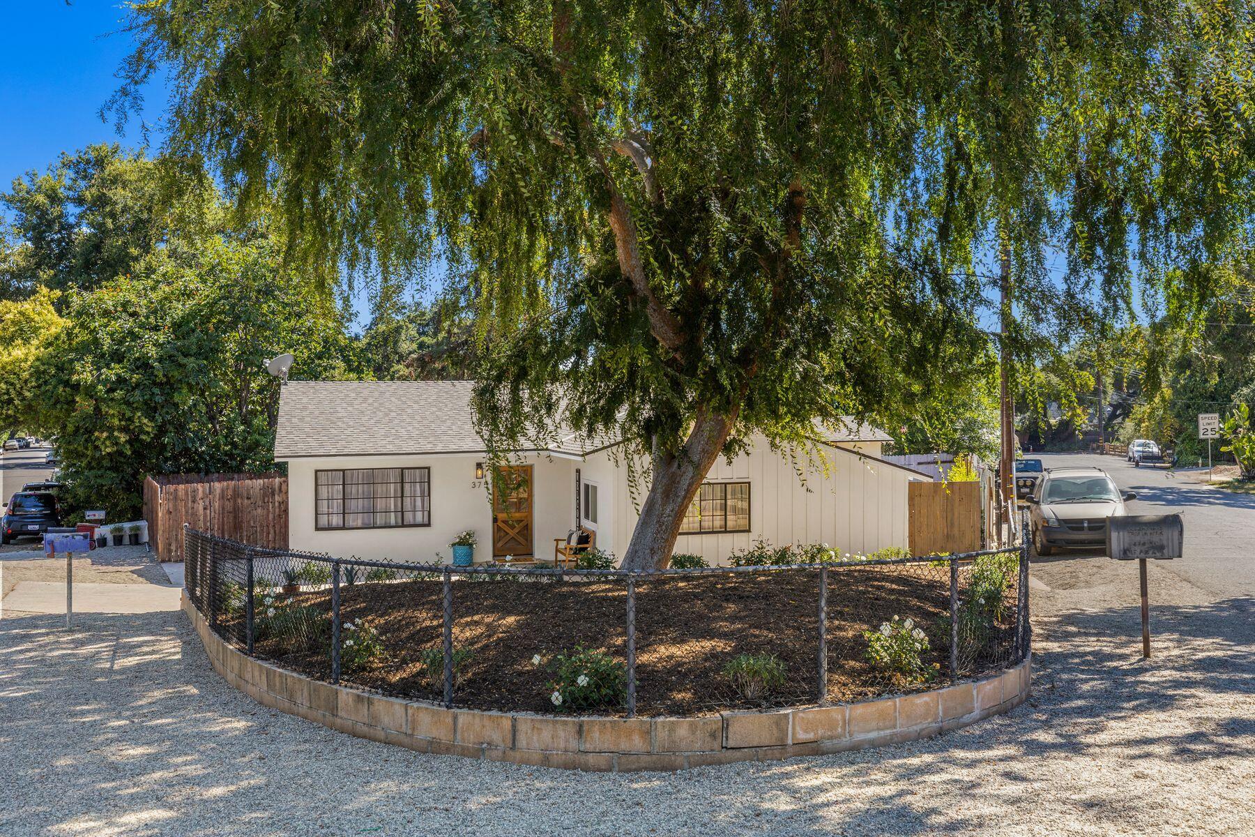 375 North Poli Avenue Ojai, CA 93023 - Photo 20 of 24 a view of a house with backyard and trees