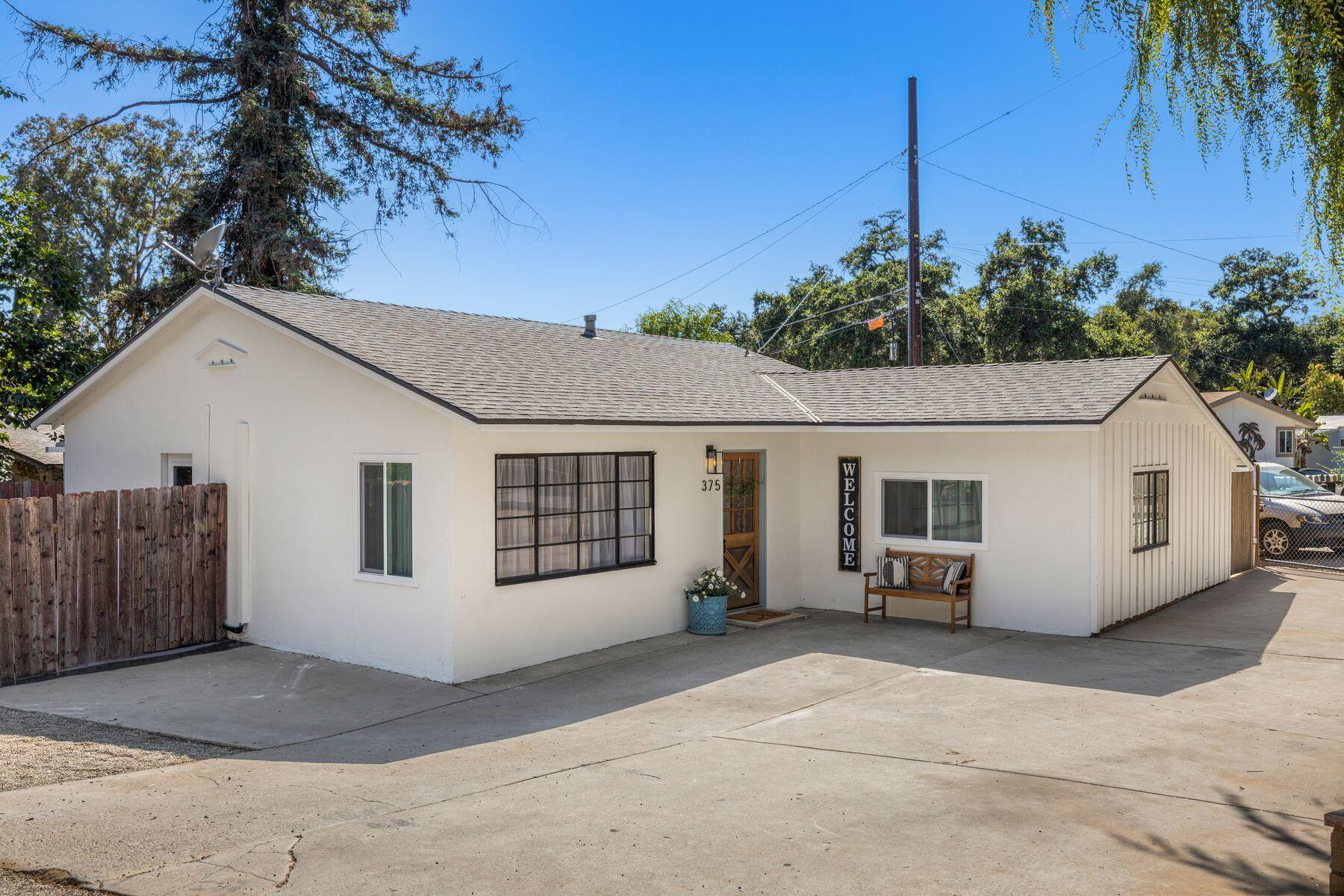 375 North Poli Avenue Ojai, CA 93023 - Photo 21 of 24 a view of a house with a backyard and potted plants