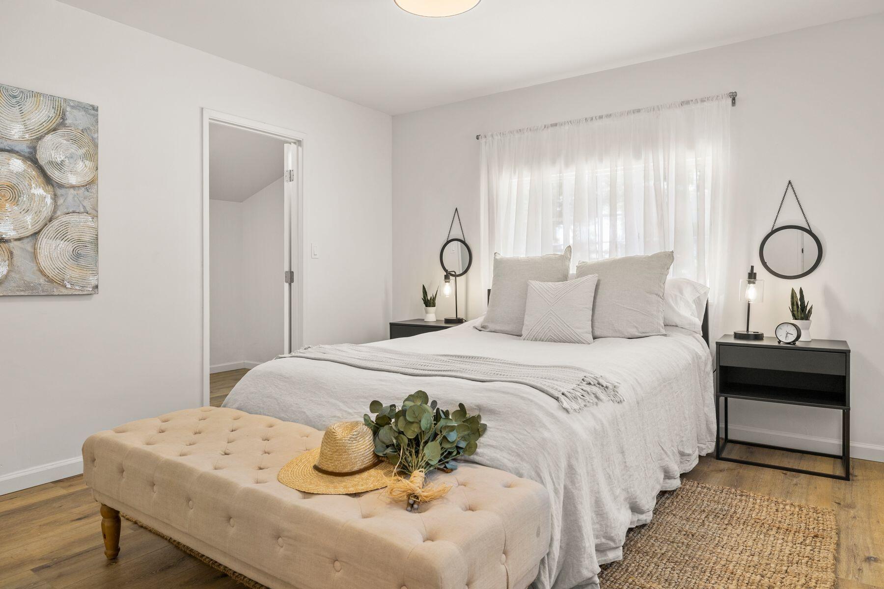 375 North Poli Avenue Ojai, CA 93023 - Photo 8 of 24 a bedroom with a bed and wooden floor