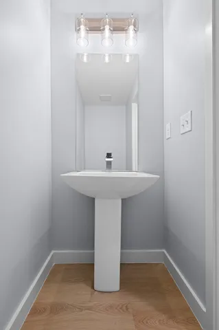 a bathroom with a sink and mirror