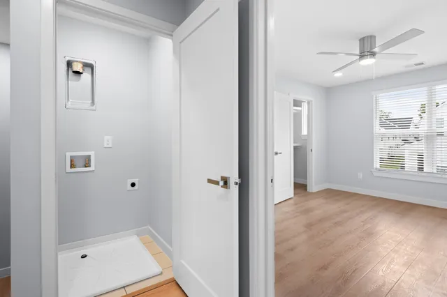 wooden floor in an empty room with a window