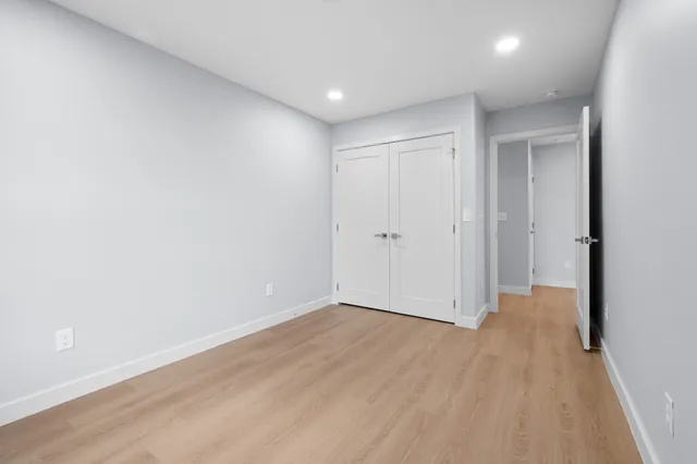 a bathroom with a sink a toilet and a window