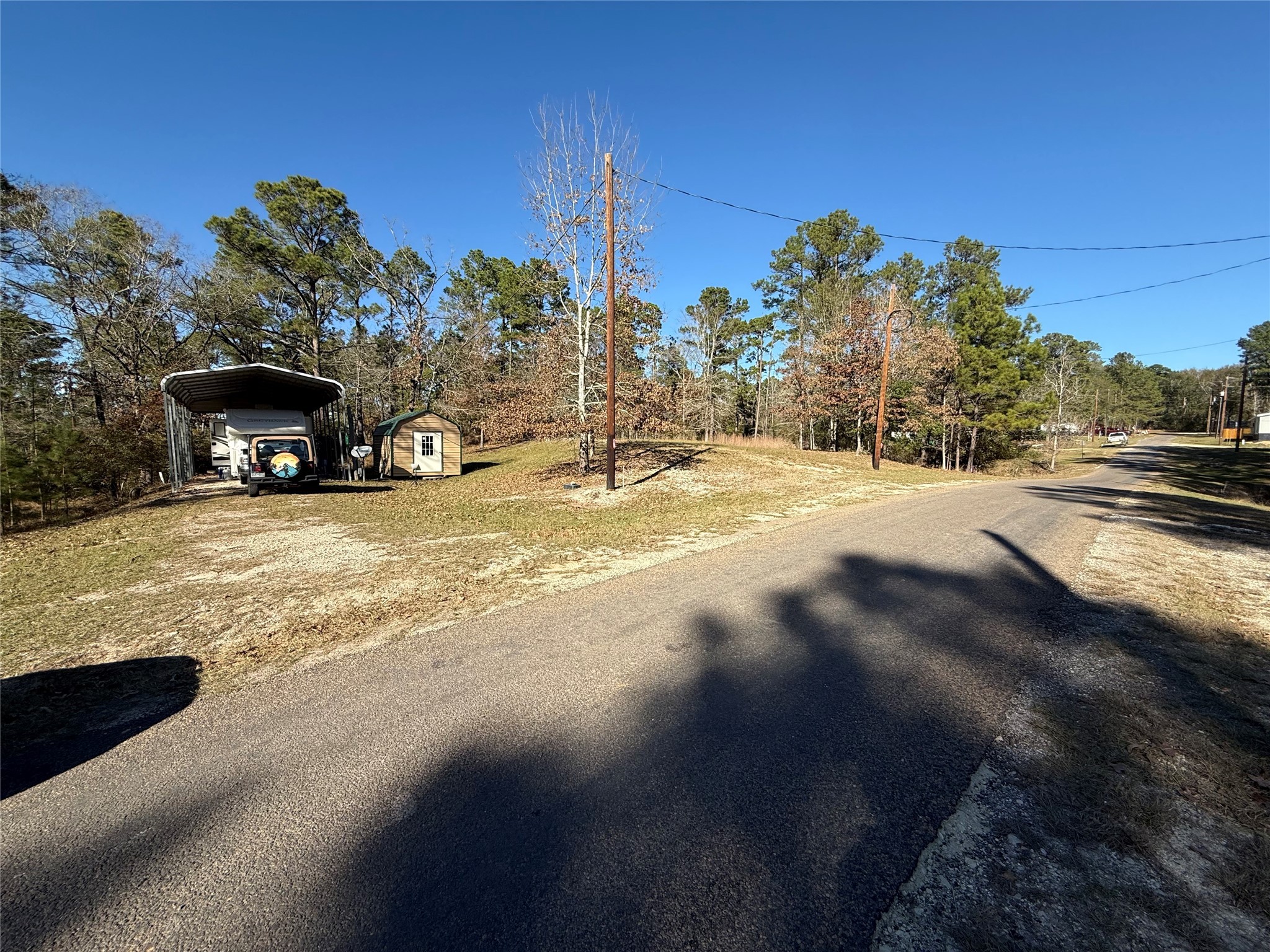 a view of a road with a building in the background