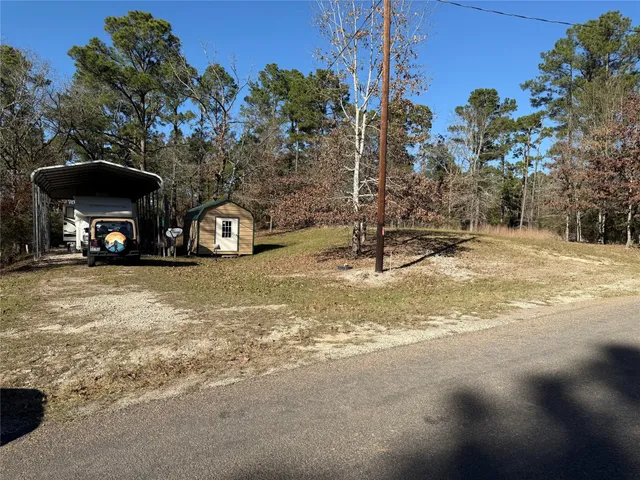 a view of a parked car in front of a house