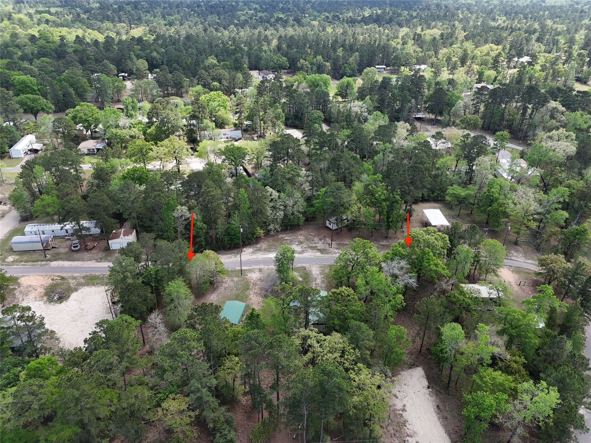 310 Oakwood Lane Trinity, TX 75862 - Photo 24 of 24 an aerial view of residential houses with outdoor space and trees