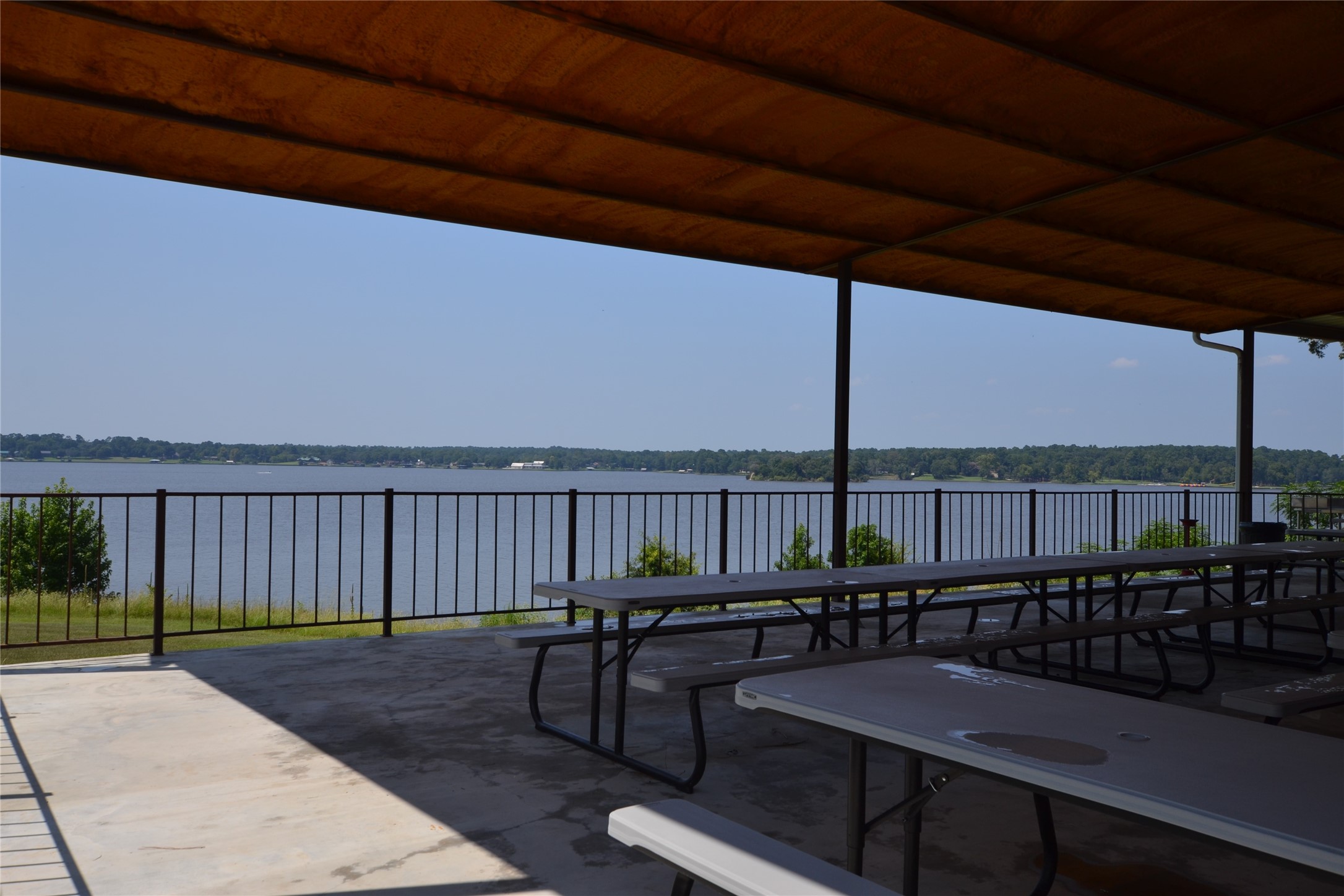 310 Oakwood Lane Trinity, TX 75862 - Photo 5 of 24 a view of a balcony with chairs and wooden fence