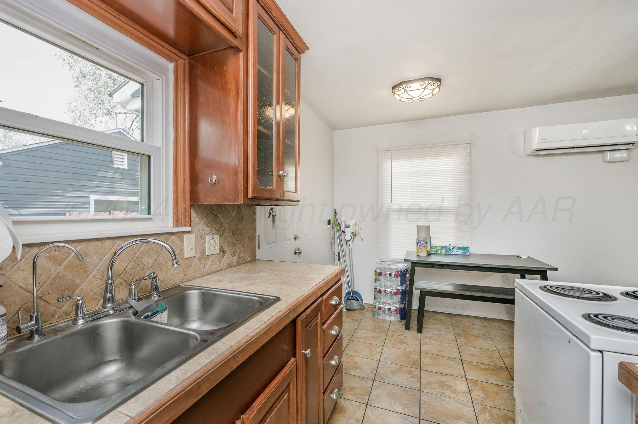 3802 South Jackson Street Amarillo, TX 79110 - Photo 10 of 20 a kitchen that has a sink and a stove
