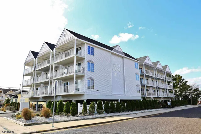 a front view of a building with street view