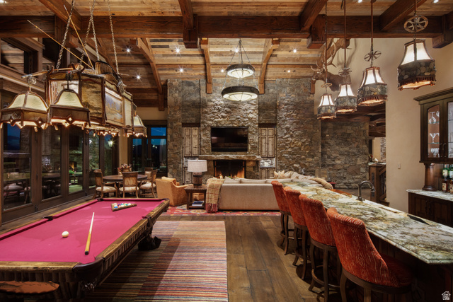 2322 North Westward Ho Road Heber City, UT 84036 - Photo 20 of 54 Playroom featuring dark wood finished floors, billiards table, a high wood beamed ceiling, a fireplace, and bar with sink