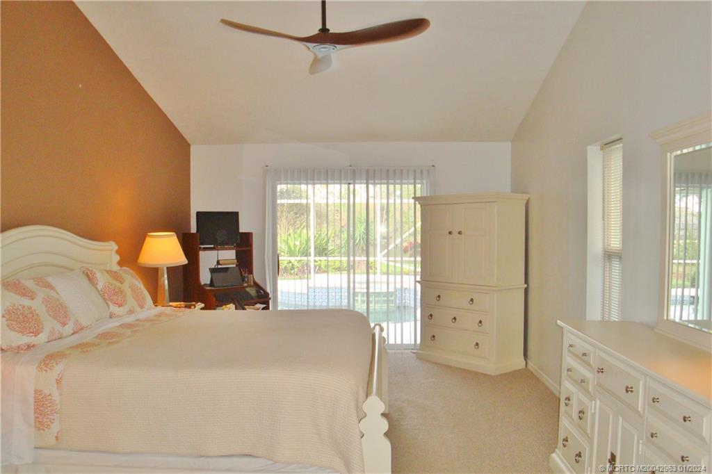 2209 Southwest Oak Ridge Road Palm City, FL 34990 - Photo 16 of 35 Master Bedroom with pool view