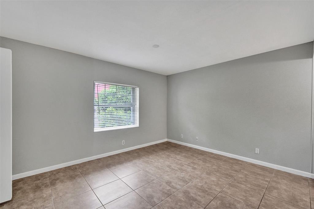 555 Southeast 8th Street, Unit 252 Deerfield Beach, FL 33441 - Photo 5 of 18 a view of an empty room with a window