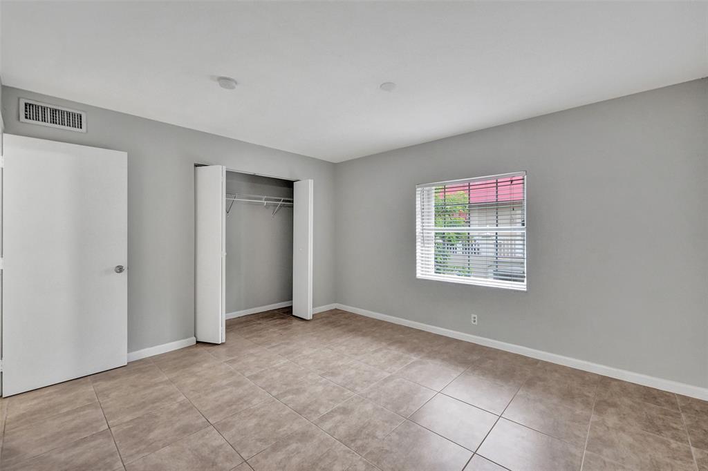 555 Southeast 8th Street, Unit 252 Deerfield Beach, FL 33441 - Photo 6 of 18 a view of an empty room with a window