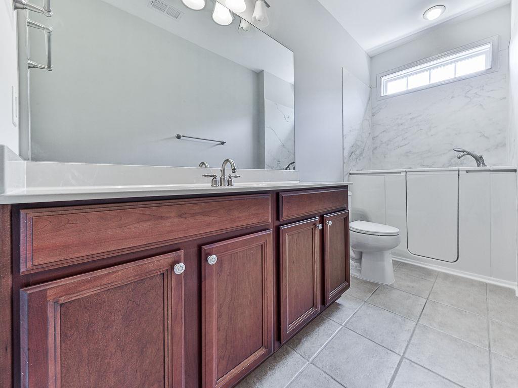 626 Laurel Crossing Canton, GA 30114 - Photo 39 of 77 a view of bathroom with a sink and a toilet