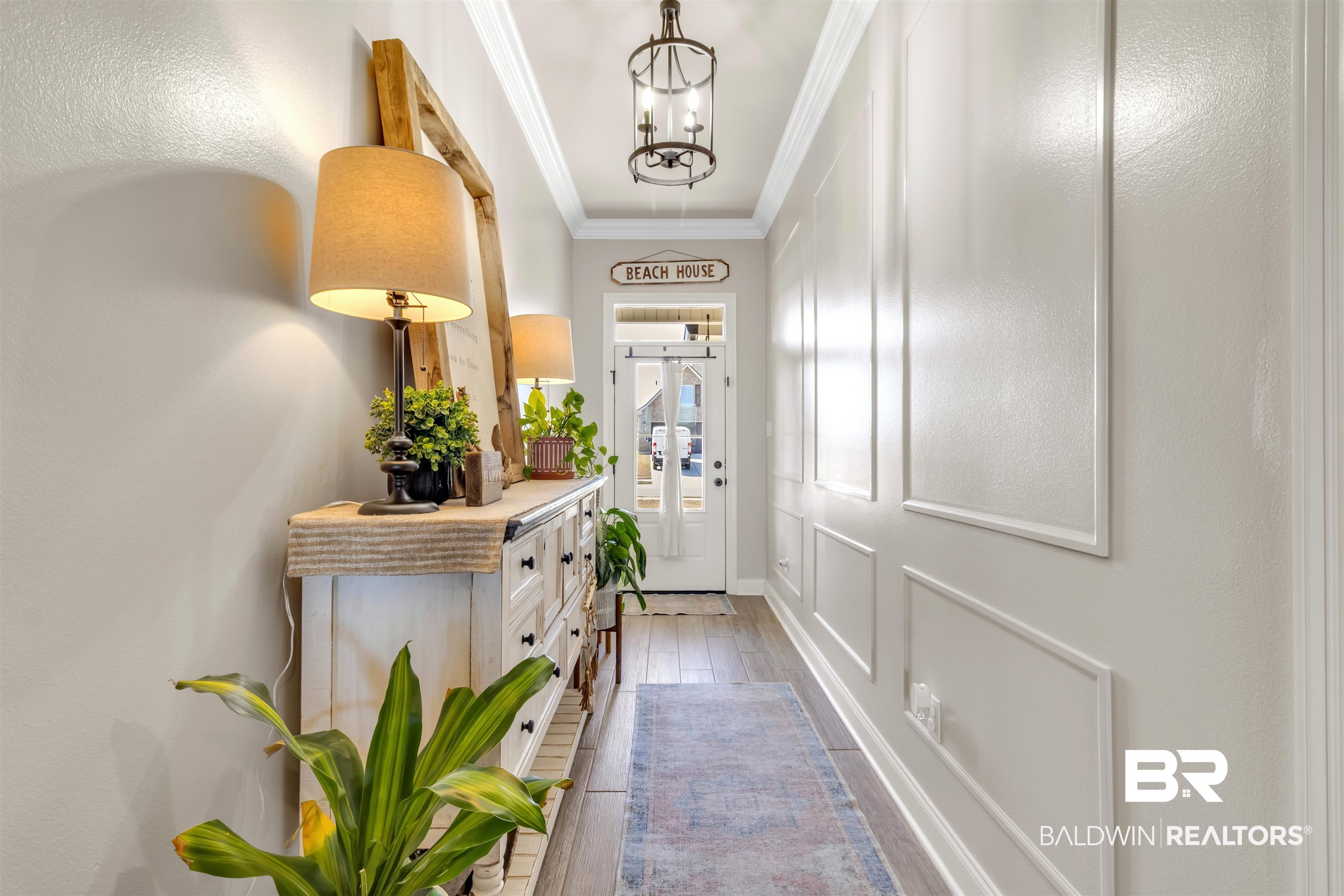 22531 Putter Lane Foley, AL 36535 - Photo 30 of 43 Entryway with crown molding, wood tiled floors, and hanging lights
