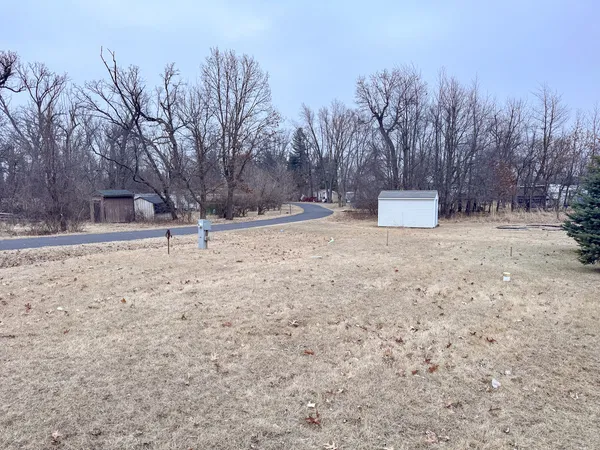a view of a house with a snow on the road