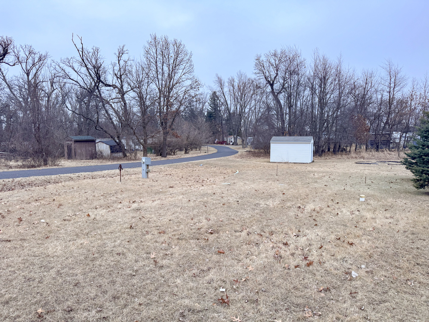 23-15 Woodhaven Sublette, IL 61367 - Photo 1 of 4 a view of a house with a snow on the road