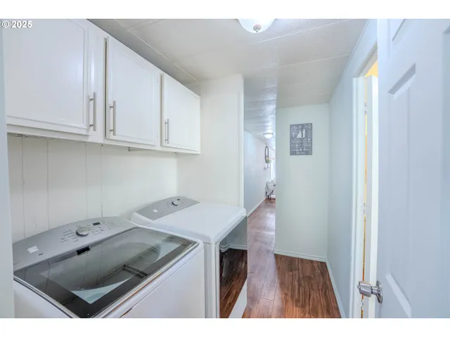 a utility room with a sink washer and dryer
