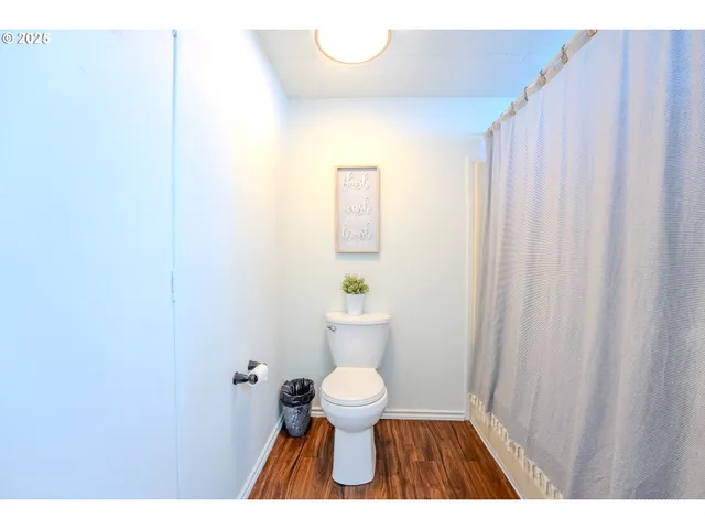 a bedroom with a bed and a night stand