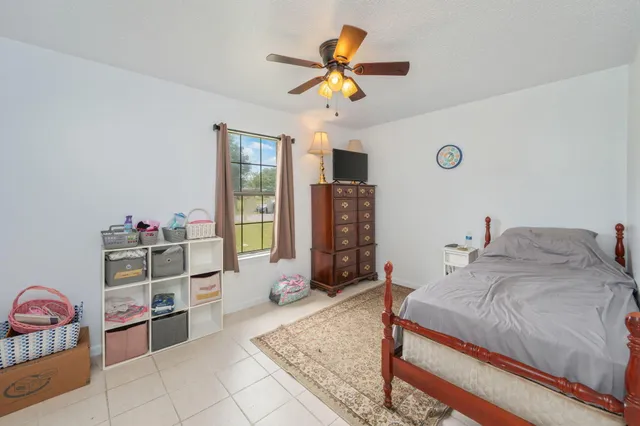 a bedroom with a bed and cabinets