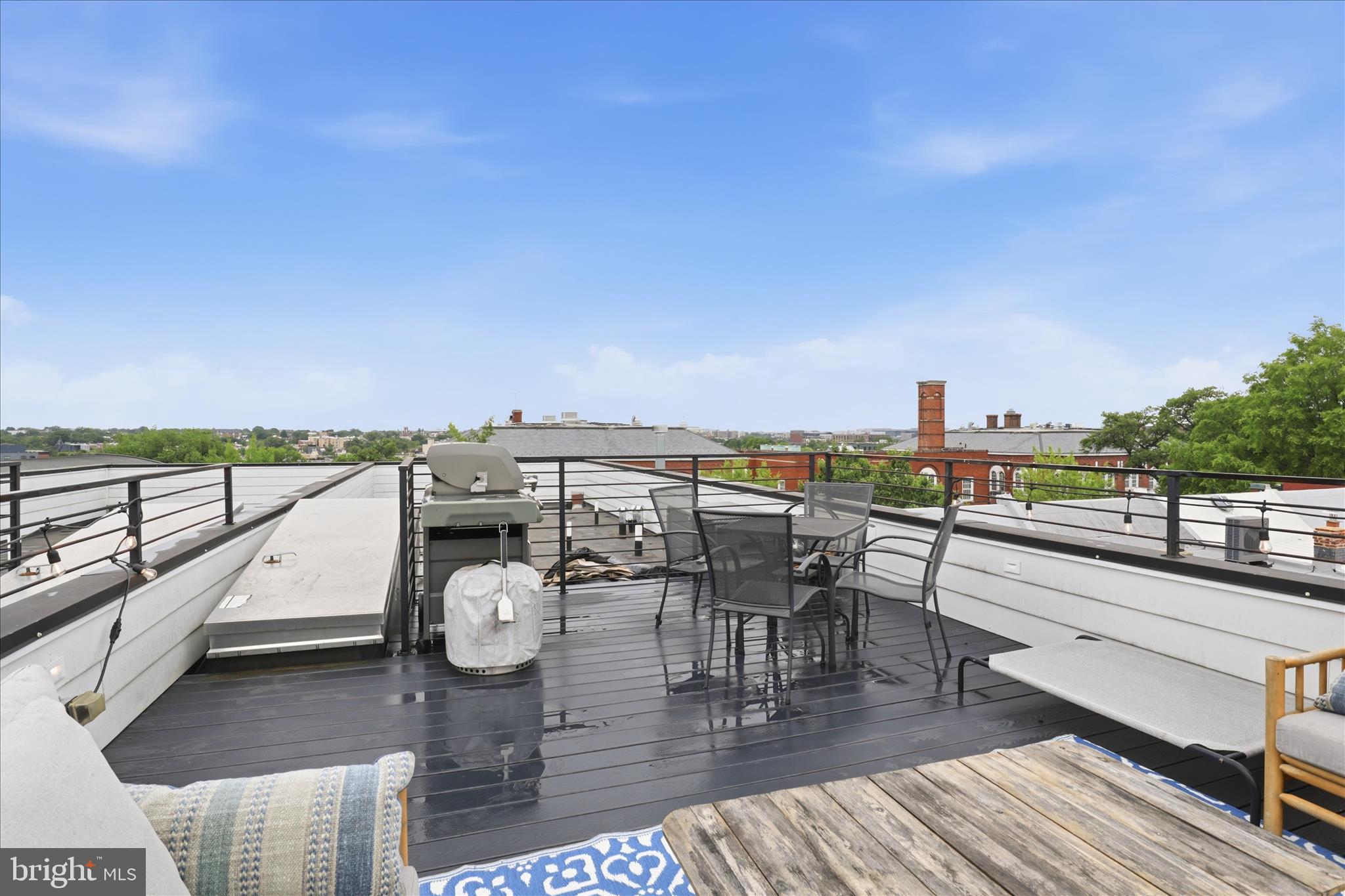 1222 Neal Street Northeast, Unit 3 Washington, DC 20002 - Photo 32 of 38 a view of a balcony with mountain view and wooden floor
