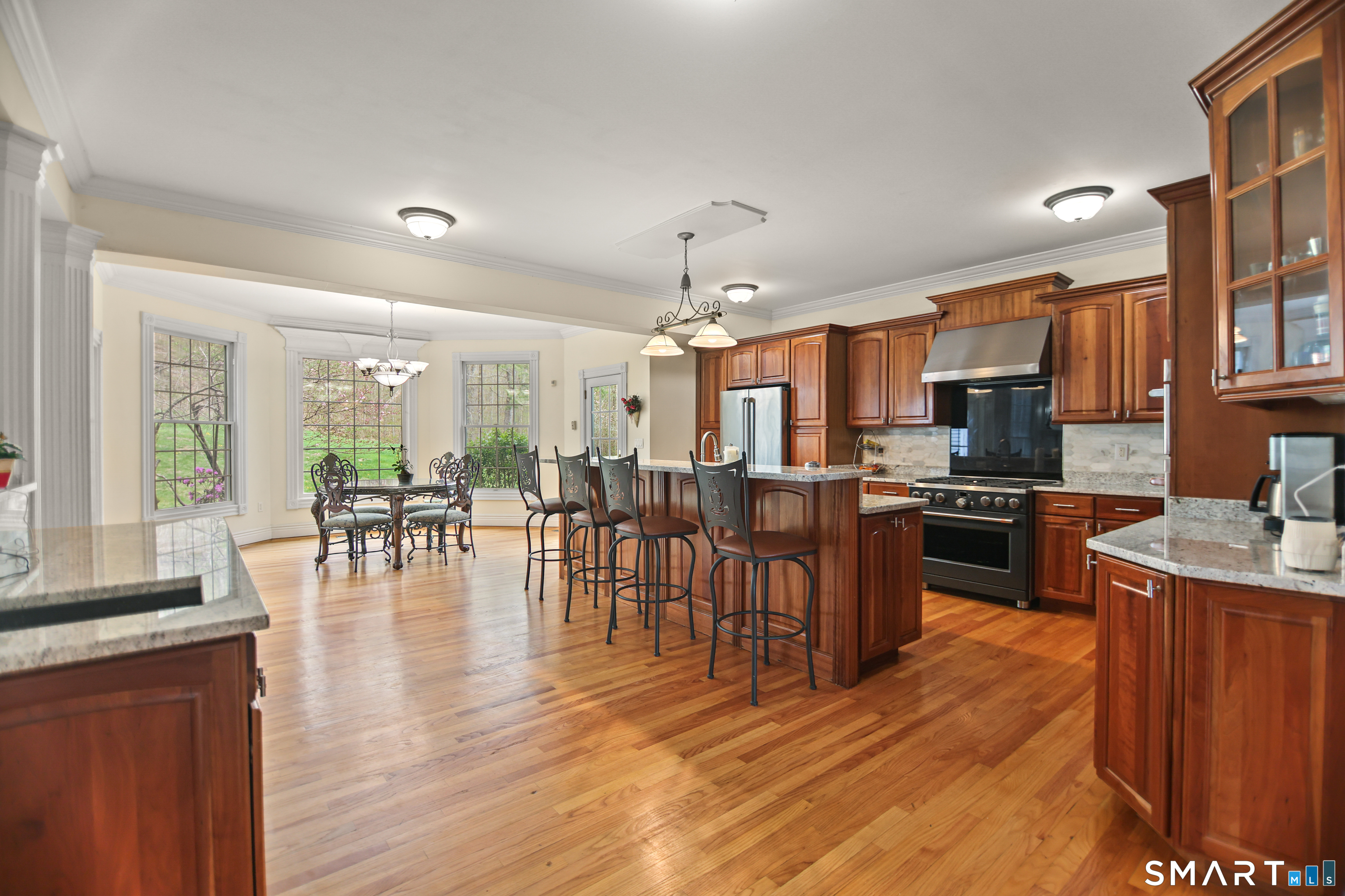 83 Bayberry Hill Road Avon, CT 06001 - Photo 16 of 34 a kitchen with lots of counter top space and living room