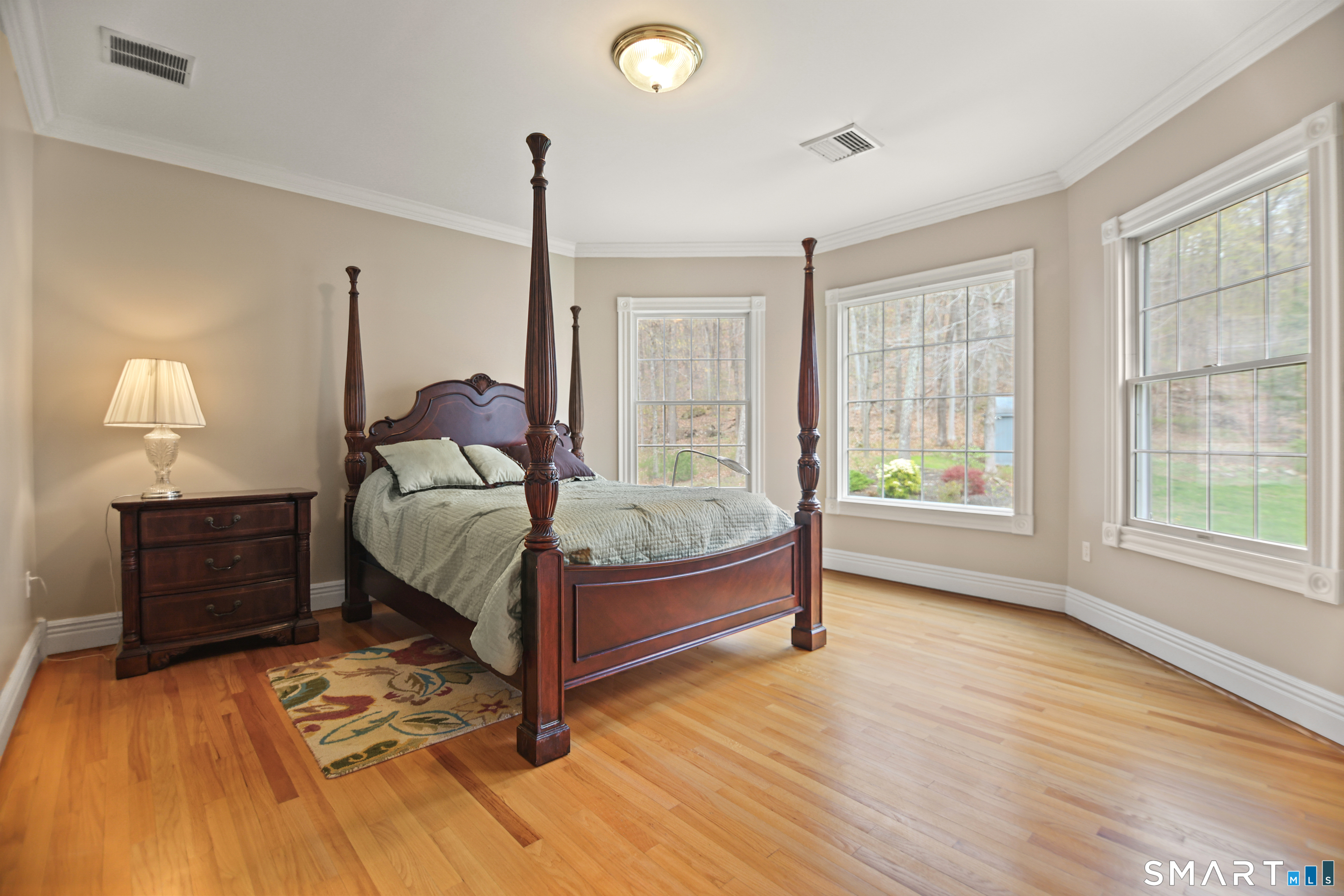 83 Bayberry Hill Road Avon, CT 06001 - Photo 24 of 34 a bedroom with a bed lamp and window