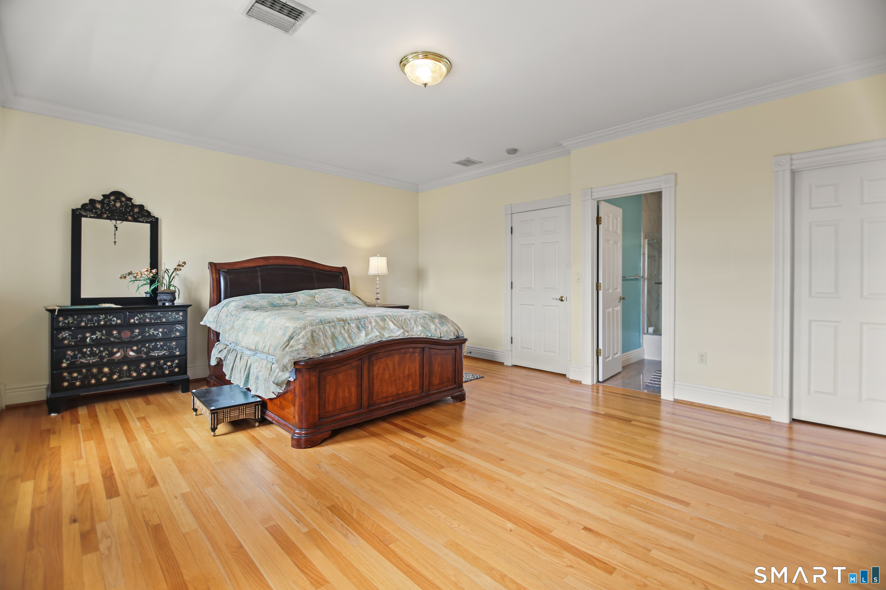83 Bayberry Hill Road Avon, CT 06001 - Photo 29 of 34 a bedroom with a bed and wooden floor