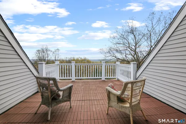 a view of a chairs on wooden deck