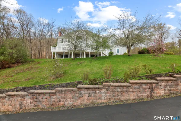 a view of a lake with a house in the background