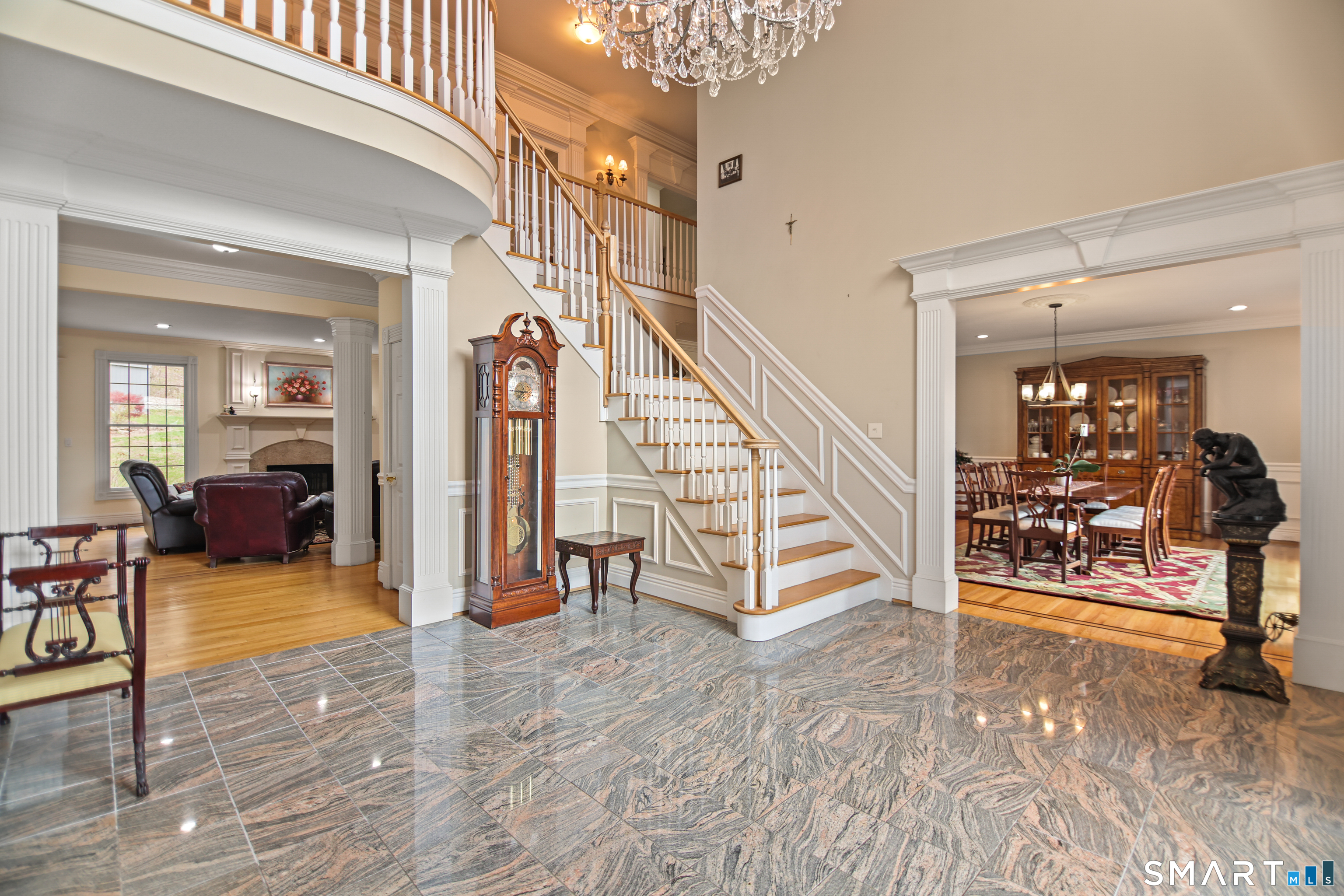 83 Bayberry Hill Road Avon, CT 06001 - Photo 9 of 34 a view of a livingroom with furniture and a hallway