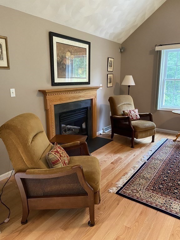 359 Concord Road Billerica, MA 01821 - Photo 12 of 35 a living room with furniture and a fireplace