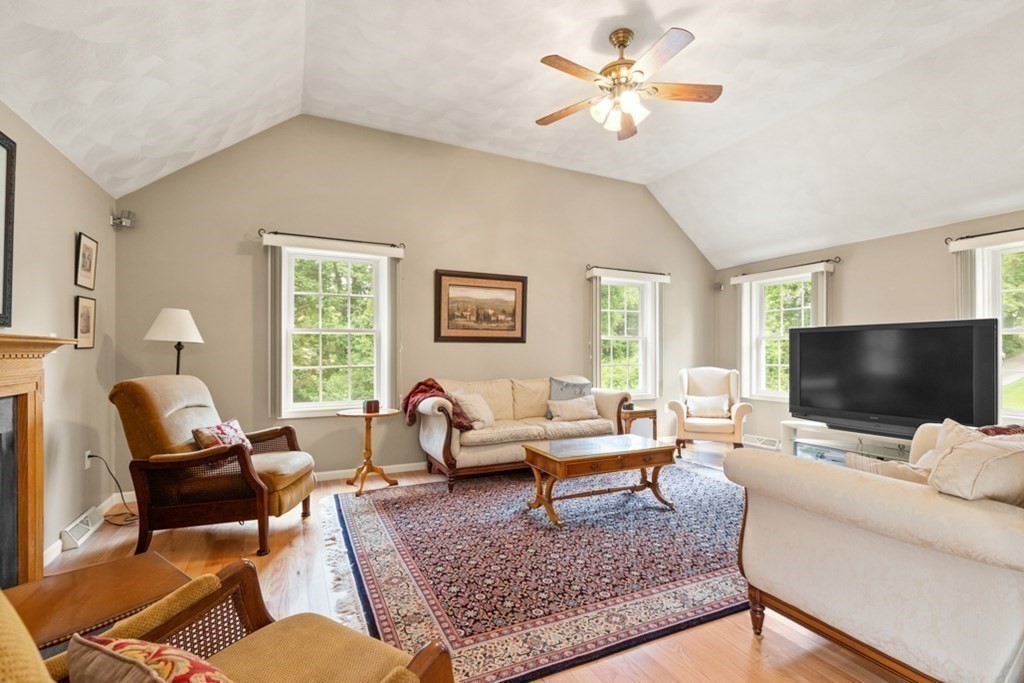 359 Concord Road Billerica, MA 01821 - Photo 13 of 35 a living room with furniture and a flat screen tv