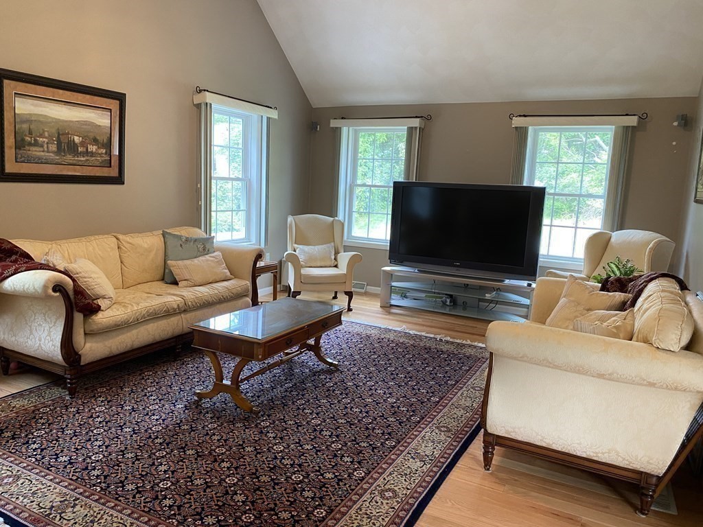 359 Concord Road Billerica, MA 01821 - Photo 14 of 35 a living room with furniture and a flat screen tv