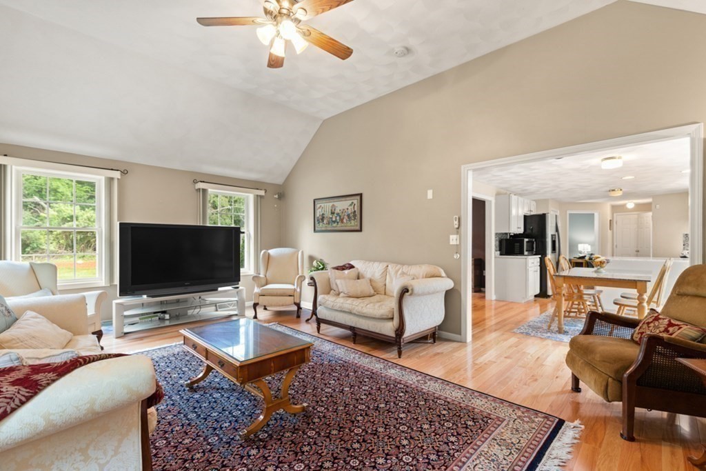 359 Concord Road Billerica, MA 01821 - Photo 15 of 35 a living room with furniture and a flat screen tv