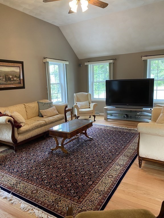 359 Concord Road Billerica, MA 01821 - Photo 16 of 35 a living room with furniture and a flat screen tv